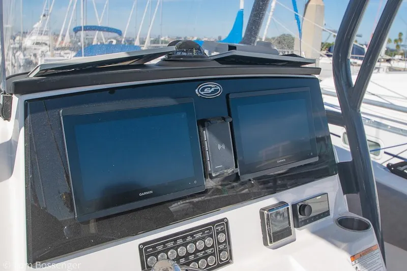 Slide: The Image of Control panel of 2022 Sea Fox 288 Commander boat with dual Garmin displays. - 10