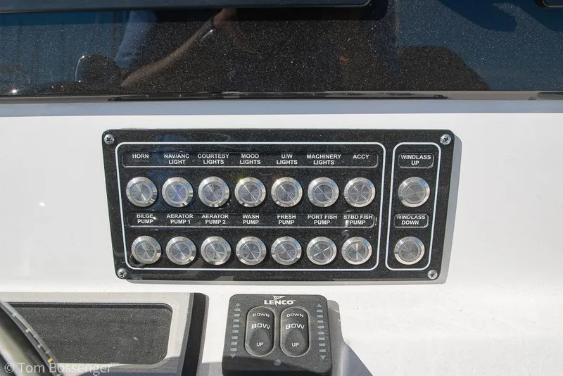 Slide: The Image of Control panel of a 2022 Sea Fox 288 Commander boat with labeled switches. - 12
