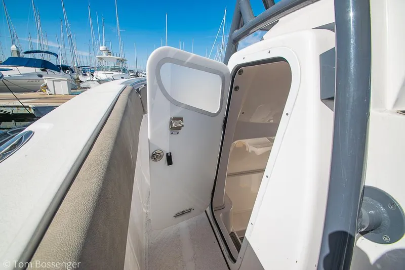 Slide: The Image of 2022 Sea Fox 288 Commander boat interior with open cabin door at marina. - 22