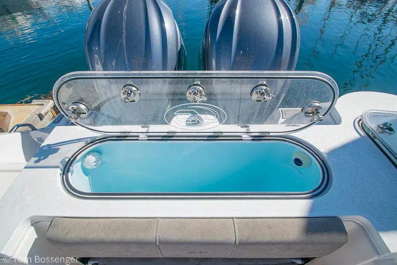 Slide: The Image of Livewell on 2022 Sea Fox 288 Commander boat with dual engines in marina. - 25