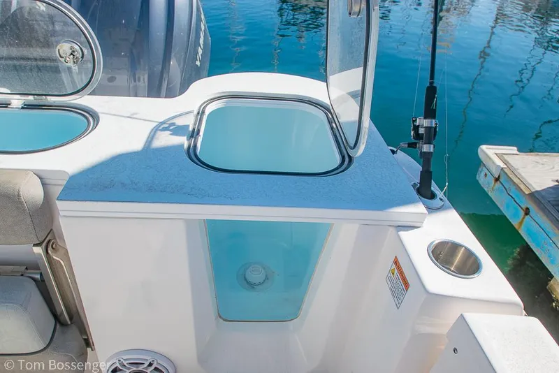 Slide: The Image of 2022 Sea Fox 288 Commander boat with open storage compartment and fishing rod holder. - 26