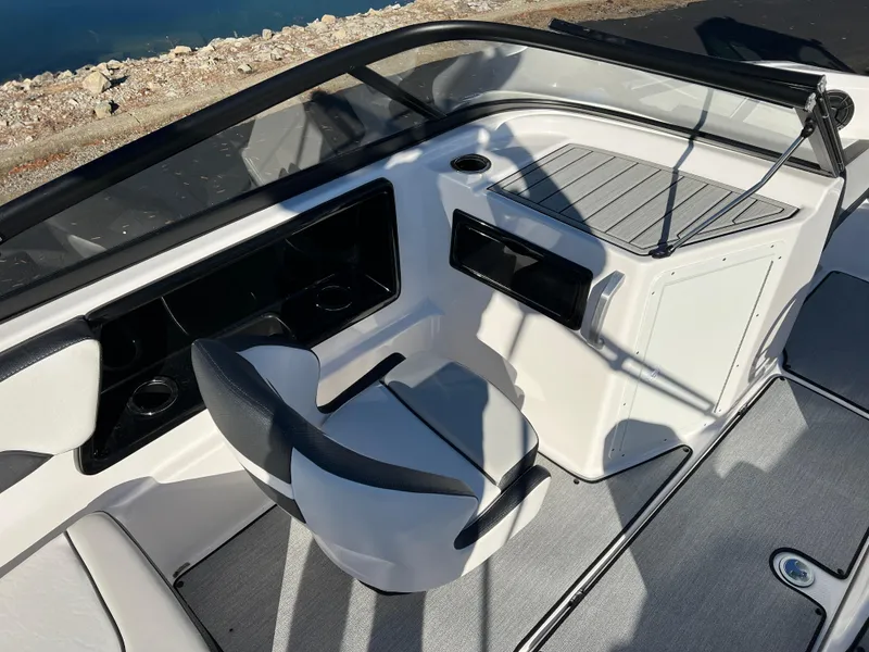 Slide: The Image of 2025 Yamaha Boats SX195 interior with sleek seating and modern dashboard design. - 10