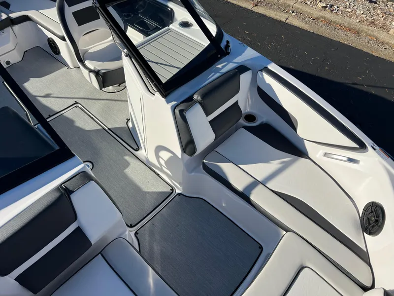 Slide: The Image of 2025 Yamaha Boats SX195 interior with sleek seating and modern design. - 14