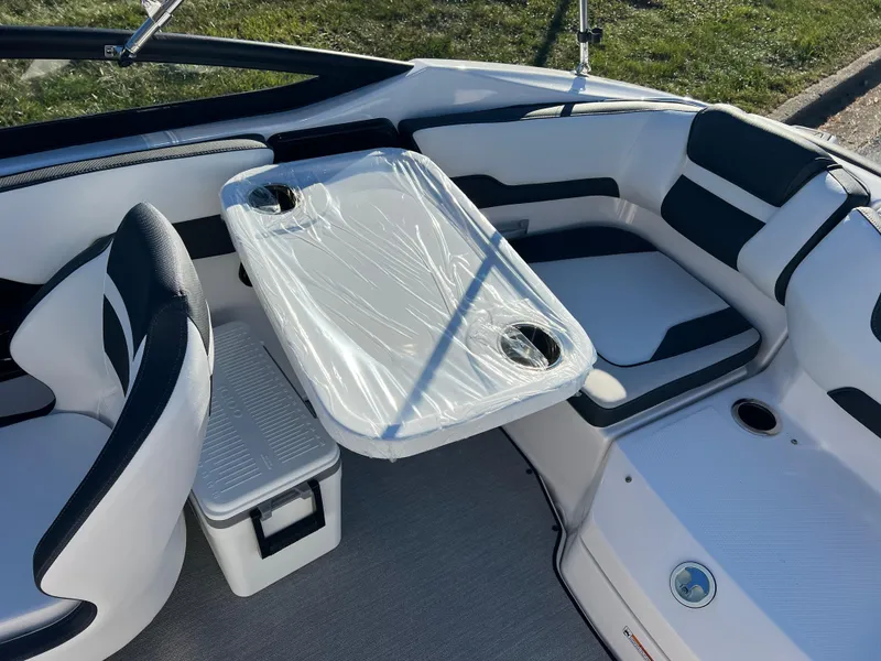 Slide: The Image of Interior of 2025 Yamaha SX195 boat with seating and table setup. - 20