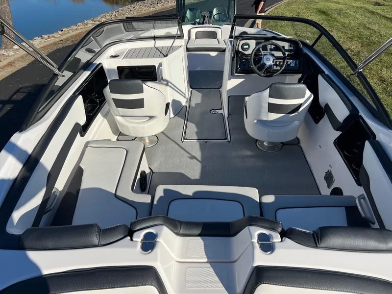 Slide: The Image of 2025 Yamaha Boats SX195 interior with modern seating and sleek design. - 8