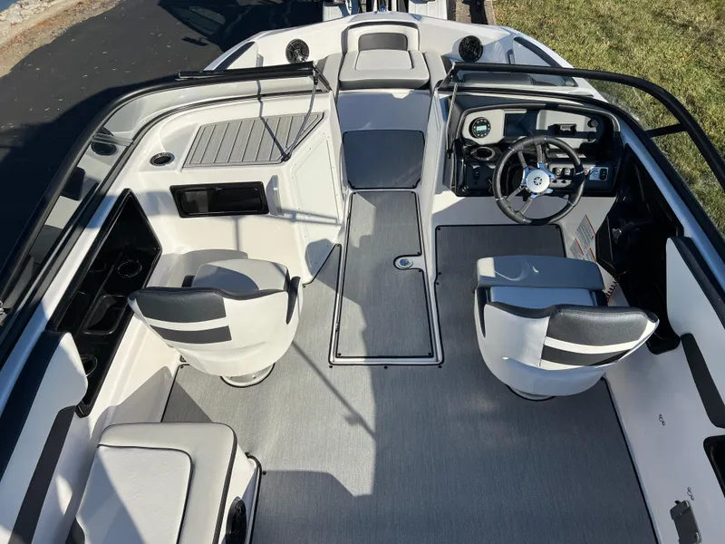 Slide: The Image of 2025 Yamaha Boats SX195 interior with modern seating and sleek dashboard design. - 9