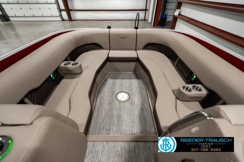 Slide: The Image of 2025 Bennington 25 LTFB boat interior with plush seating and cup holders. - 18