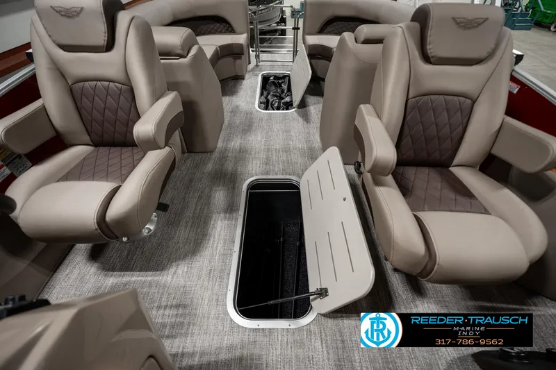 Slide: The Image of 2025 Bennington 25 LTFB boat interior with luxurious seating and storage compartment. - 23
