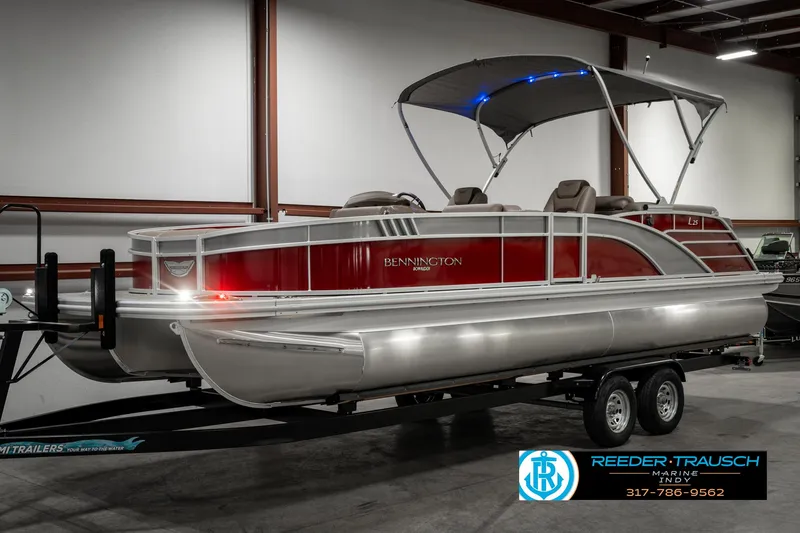 Slide: The Image of 2025 Bennington 25 LTFB pontoon boat on trailer in showroom. - 3