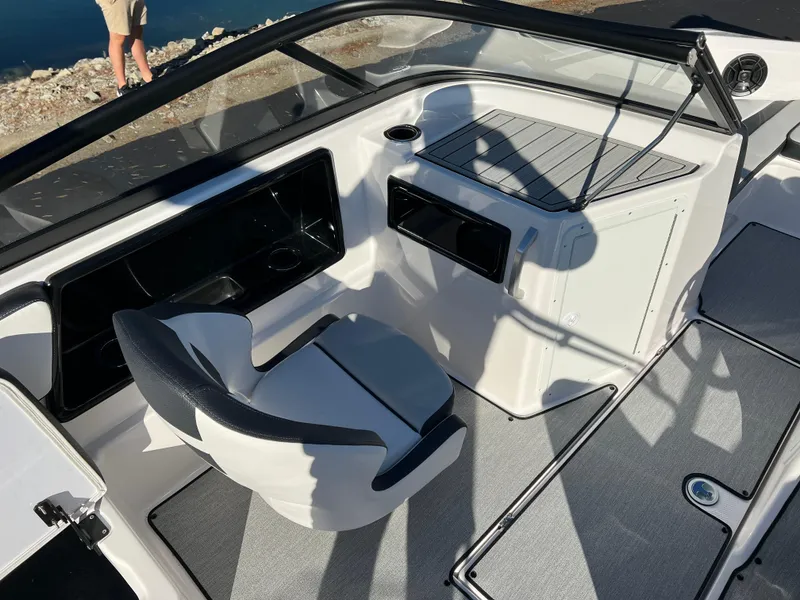 Slide: The Image of 2025 Yamaha Boats SX195 interior with sleek seating and modern dashboard design. - 11