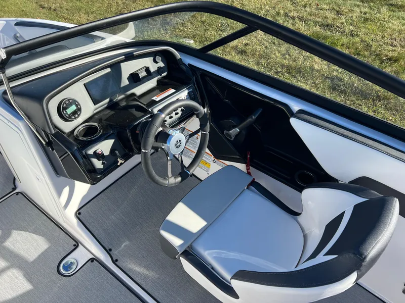 Slide: The Image of 2025 Yamaha Boats SX195 cockpit with modern steering and dashboard design. - 12