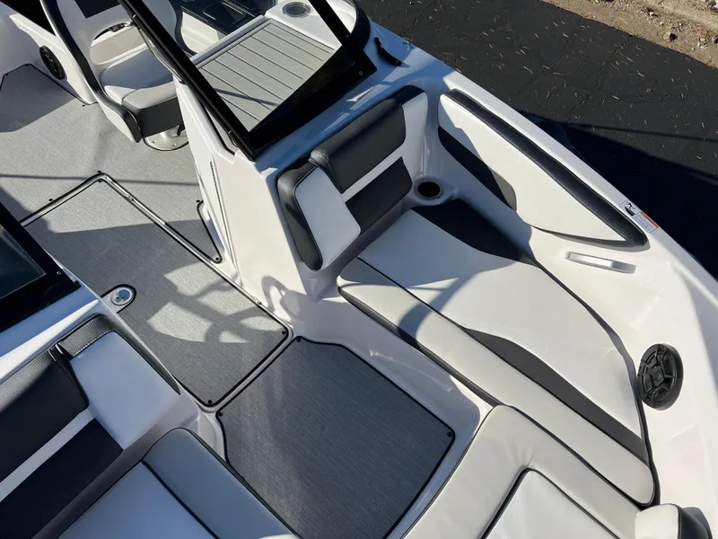 Slide: The Image of 2025 Yamaha Boats SX195 interior with sleek seating and modern design. - 16