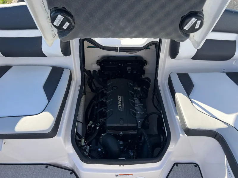 Slide: The Image of 2025 Yamaha Boats SX195 engine compartment with open hatch, showcasing interior design. - 20