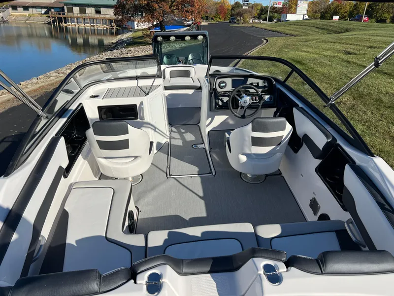 Slide: The Image of 2025 Yamaha Boats SX195 interior, featuring sleek seating and modern dashboard design. - 8