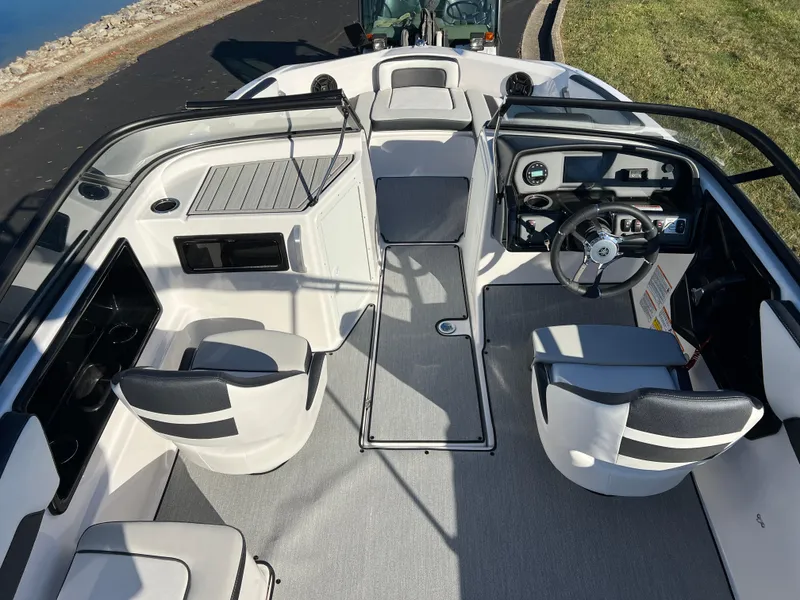 Slide: The Image of 2025 Yamaha Boats SX195 interior with modern seating and sleek dashboard design. - 9