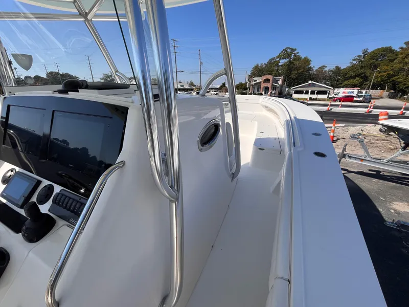 Slide: The Image of 2018 Regulator 34 boat with sleek design and modern controls. - 13