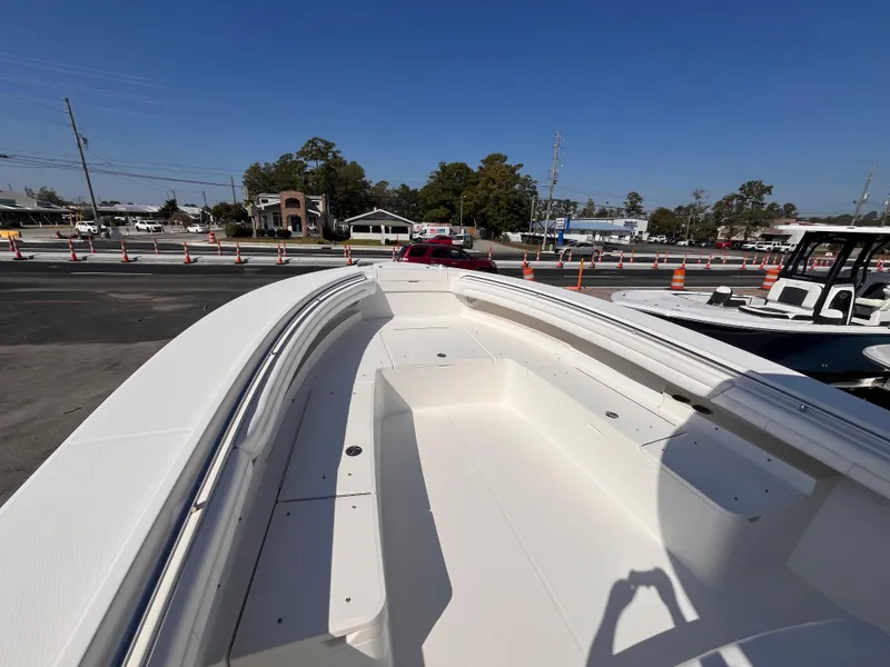 Slide: The Image of 2018 Regulator 34 boat deck in a sunny outdoor setting. - 17
