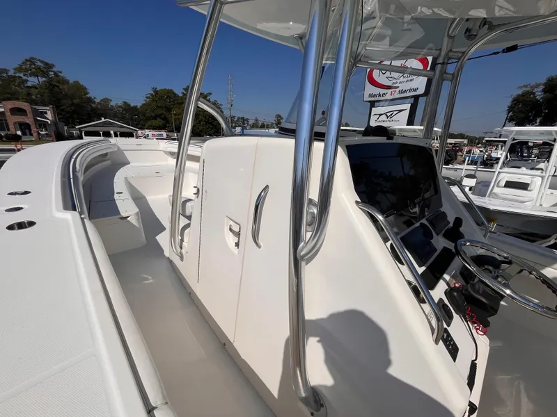 Slide: The Image of 2018 Regulator 34 boat interior with helm and seating area. - 18
