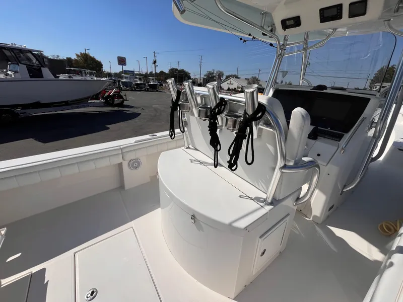 Slide: The Image of 2018 Regulator 34 boat interior with rod holders and helm station. - 8