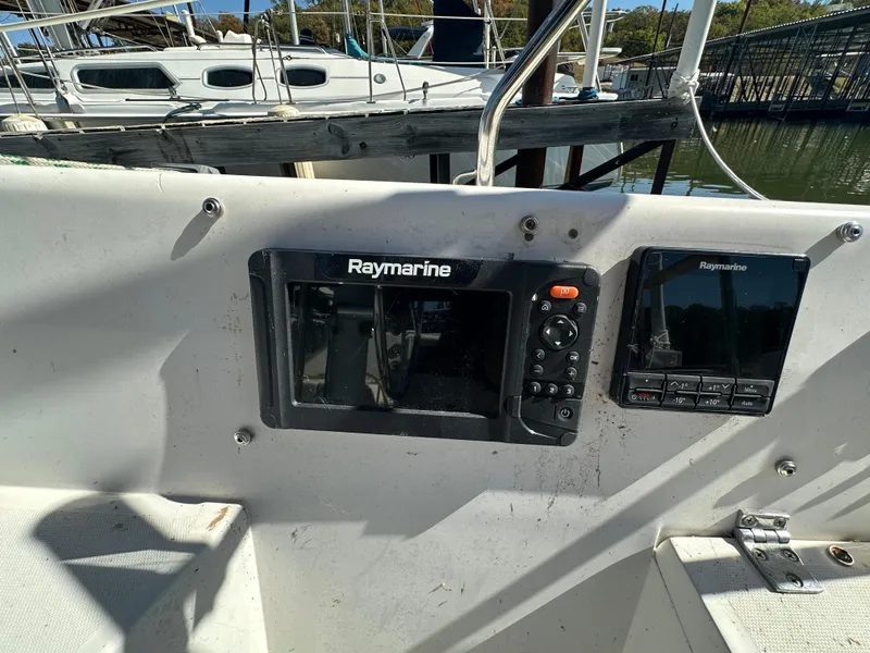 Slide: The Image of Raymarine navigation equipment on 1991 Catalina 28 sailboat cockpit. - 11