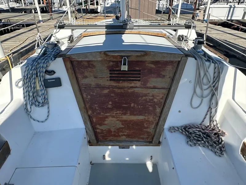 Slide: The Image of 1991 Catalina 28 sailboat cockpit with ropes and wooden hatch. - 12