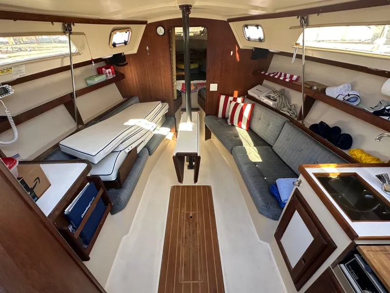 Slide: The Image of Interior of 1991 Catalina 28 sailboat with cozy seating and wooden finishes. - 14