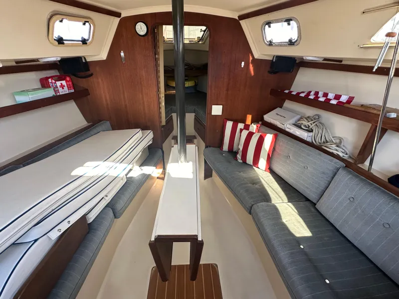 Slide: The Image of Interior of a 1991 Catalina 28 sailboat with cozy seating and nautical decor. - 15