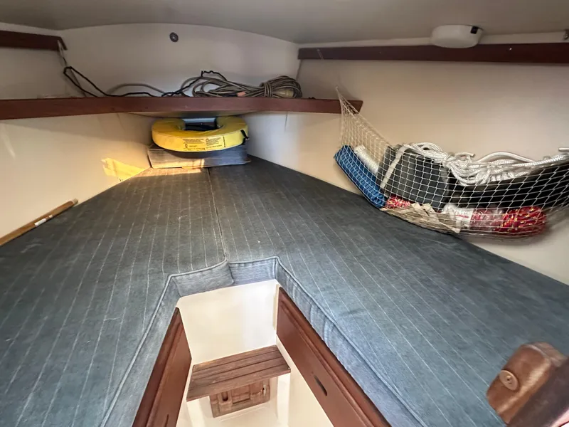 Slide: The Image of Interior cabin of 1991 Catalina 28 sailboat with storage and cushions. - 19
