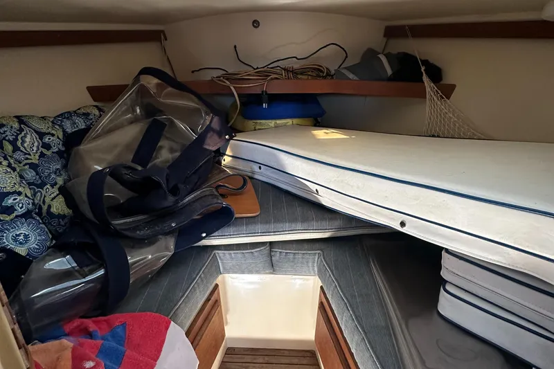 Slide: The Image of Interior cabin of 1991 Catalina 28 sailboat with cushions and storage. - 27