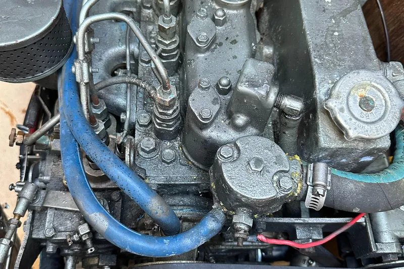 Slide: The Image of Close-up of a 1991 Catalina 28 engine with visible hoses and components. - 32