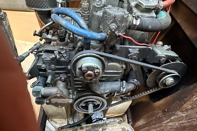 Slide: The Image of Close-up of a 1991 Catalina 28 engine with visible belts and hoses. - 33