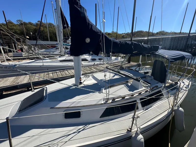 Slide: The Image of 1991 Catalina 28 sailboat docked at marina, sunny day, blue sail cover. - 6