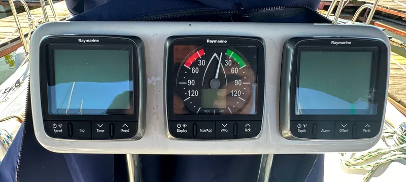 Slide: The Image of Raymarine navigation instruments on a 1991 Catalina 28 sailboat dashboard. - 9