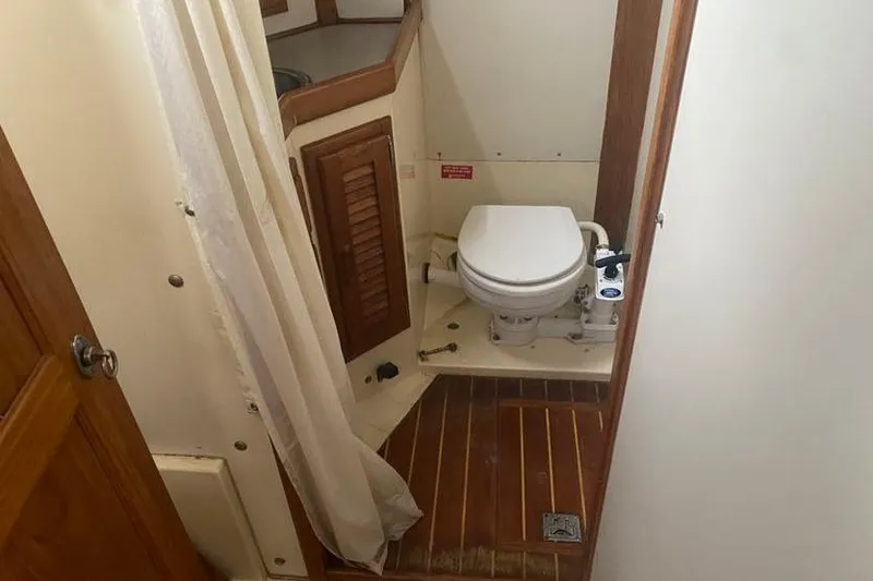 Slide: The Image of Bathroom interior of 1993 Pacific Seacraft 44 Voyager yacht with wooden flooring. - 15