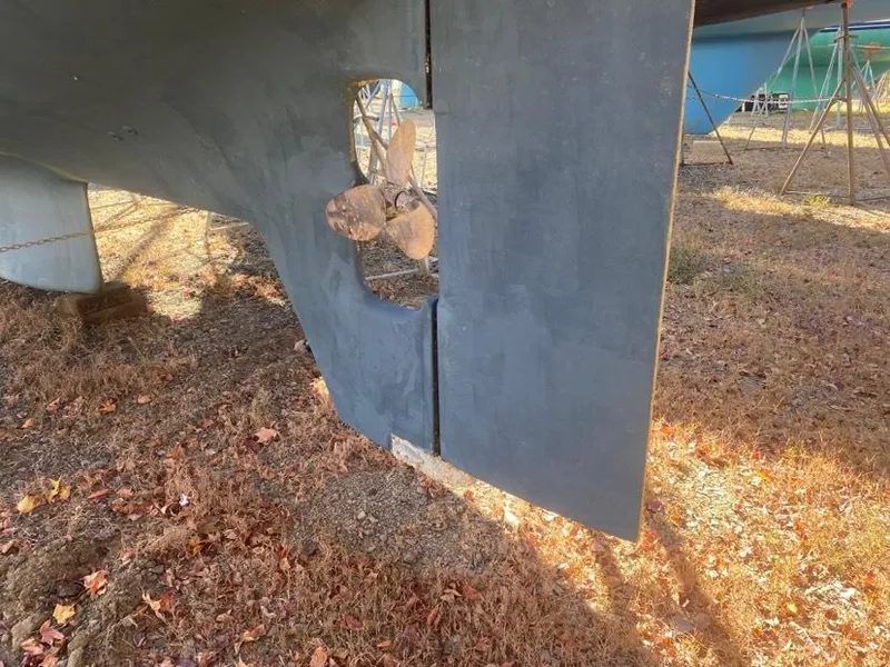 Slide: The Image of Propeller and rudder of 1993 Pacific Seacraft 44 Voyager sailboat on dry land. - 9