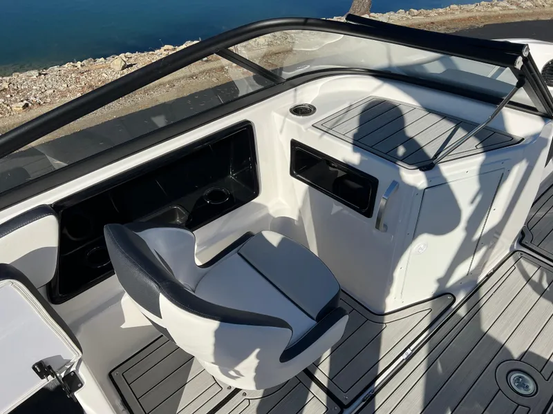 Slide: The Image of 2025 Yamaha Boats 195S cockpit with sleek seating and modern dashboard design. - 10