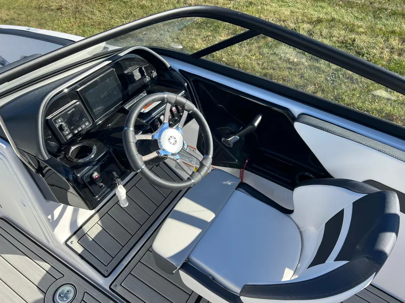 Slide: The Image of 2025 Yamaha Boats 195S cockpit with modern steering and dashboard controls. - 11