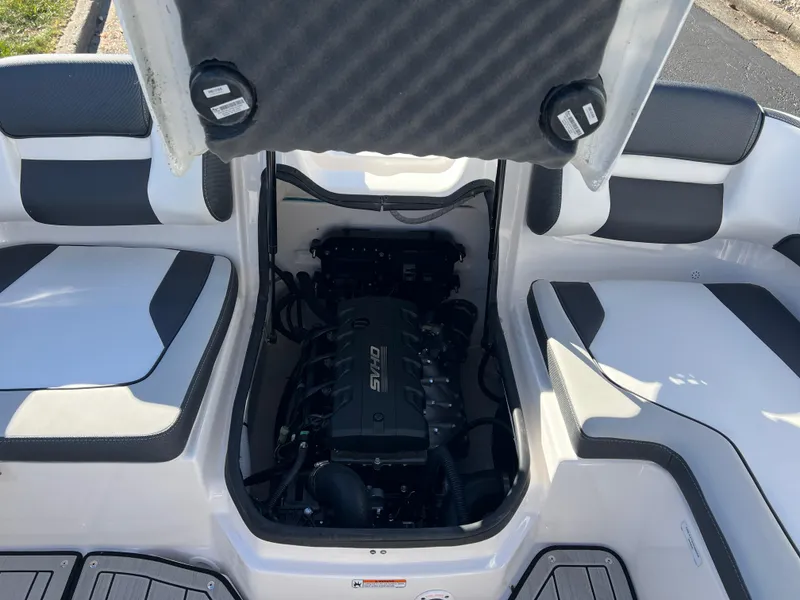 Slide: The Image of 2025 Yamaha Boats 195S engine compartment with open hatch, showcasing interior design. - 20