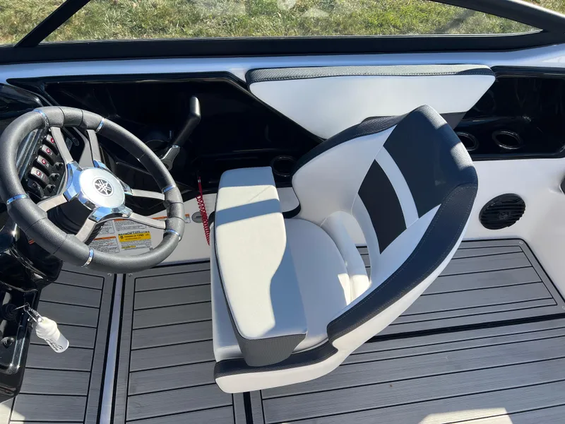 Slide: The Image of 2025 Yamaha Boats 195S interior with steering wheel and captain's chair. - 21