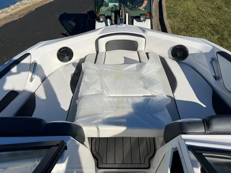 Slide: The Image of 2025 Yamaha Boats 195S interior with cushioned seating and speakers. - 23