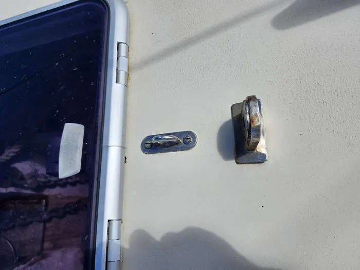 Slide: The Image of 1983 Morgan Schooner deck hardware and hatch detail. - 14