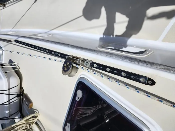 Slide: The Image of 1983 Morgan Schooner deck with rigging and hardware details. - 19