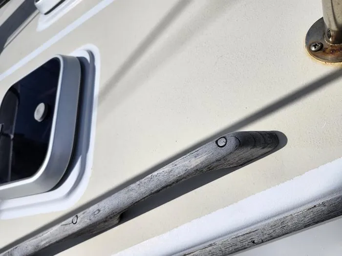 Slide: The Image of 1983 Morgan Schooner deck detail with wooden handrail and hatch. - 21