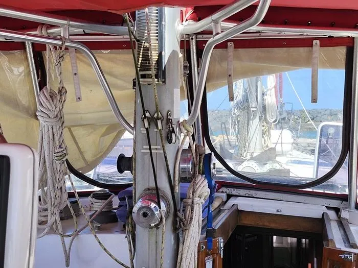 Slide: The Image of Interior view of a 1983 Morgan Schooner sailboat with ropes and equipment. - 27