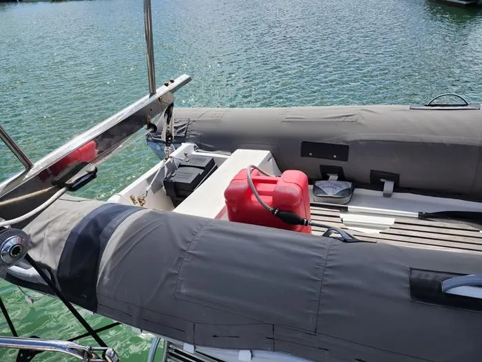 Slide: The Image of 1983 Morgan Schooner deck with inflatable boat and red fuel container. - 3