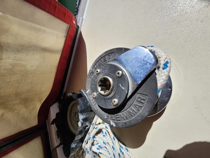 Slide: The Image of Winch mechanism on 1983 Morgan Schooner sailboat with rope and sail detail. - 38