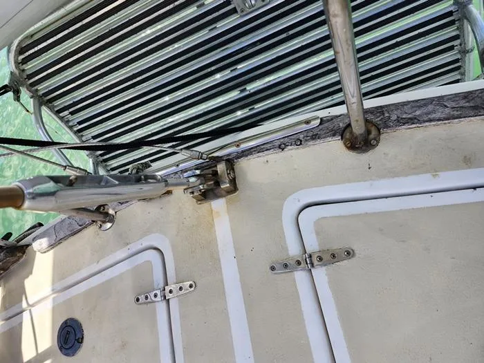 Slide: The Image of 1983 Morgan Schooner deck with metal fittings and hatch details. - 4