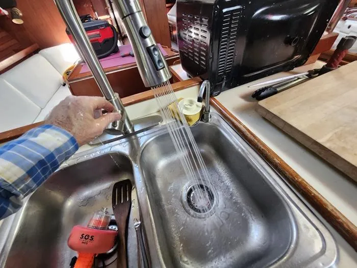 Slide: The Image of Kitchen sink on 1983 Morgan Schooner yacht with running water and utensils. - 49