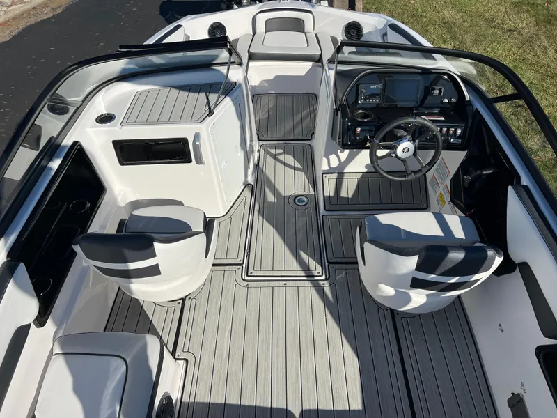 Slide: The Image of 2025 Yamaha Boats 195S interior with sleek seating and modern dashboard design. - 10