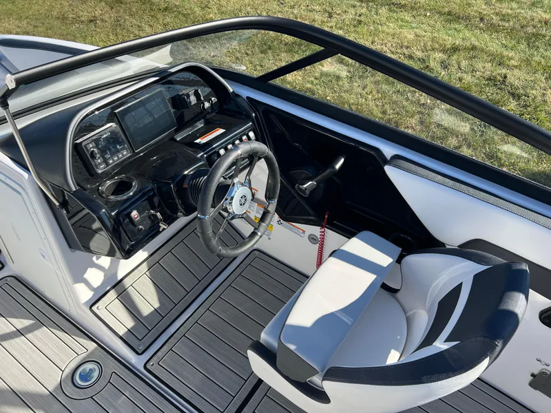 Slide: The Image of 2025 Yamaha Boats 195S cockpit with modern steering and dashboard design. - 12